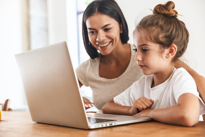 A mother and daughter on the pc