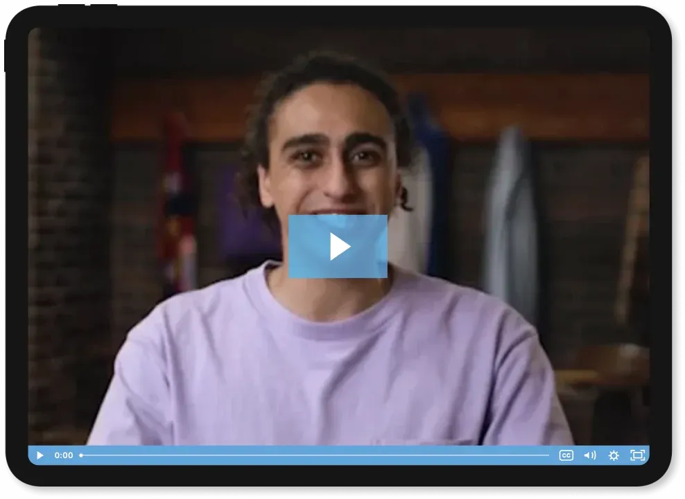 A teen student in a video frame looking at the camera.