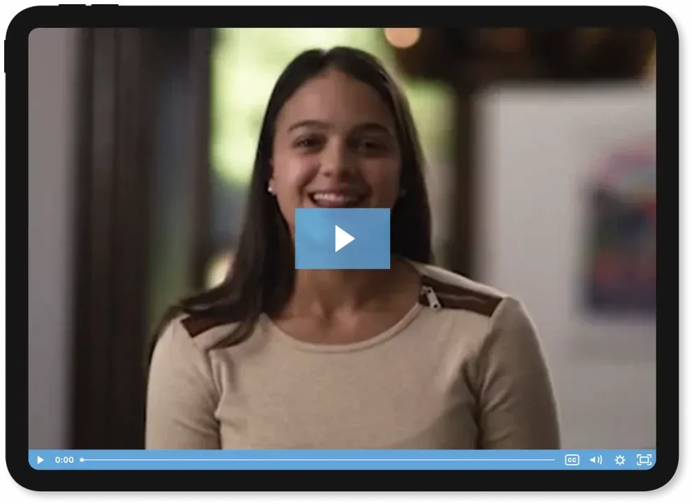 A teen student in a video frame looking at the camera.