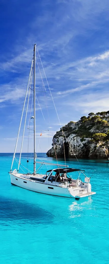 A boat floating in a tropical coast.