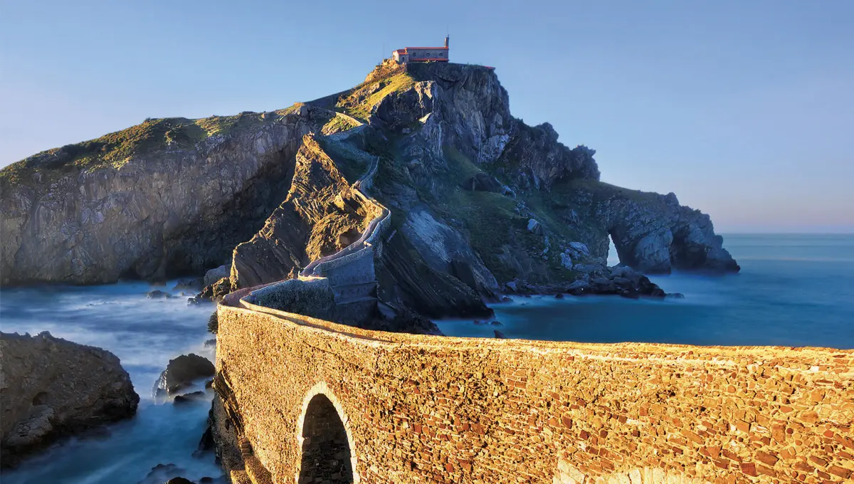 A beautiful bridge path in going across the ocean in Spain to an island.