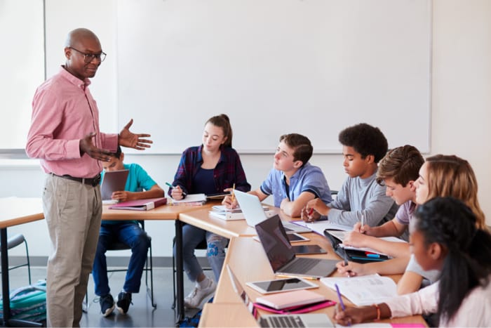 Teacher supporting students