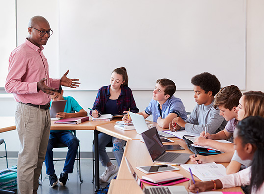 A teacher in front of the classroom