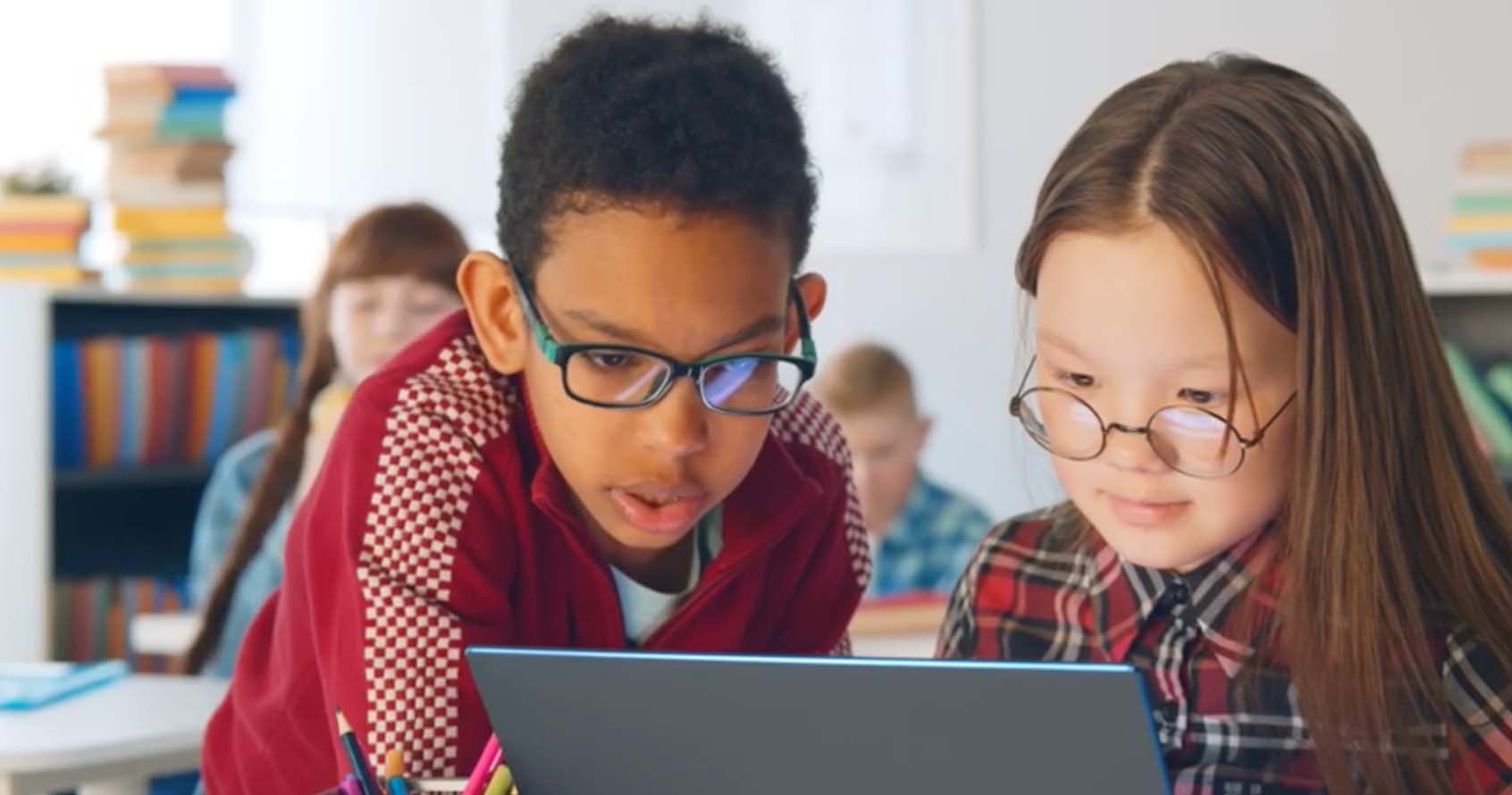 Kids looking at a computer